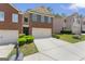Brick townhome featuring a well-manicured lawn and a convenient two-car garage at 2714 Haynescrest Dr, Grayson, GA 30017