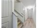 Inviting hallway with hardwood floors, staircase, and modern lighting fixtures at 2714 Haynescrest Dr, Grayson, GA 30017
