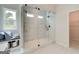 Modern bathroom with a glass-enclosed shower, marble tiling, and natural light at 4484 Eastbrook Pl # 54B, Snellville, GA 30039