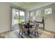Dining area with a round table, four chairs, and view of the backyard at 4484 Eastbrook Pl # 54B, Snellville, GA 30039