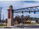 View of the Snellville town entrance featuring brick pillars and overhead metal structure at 4484 Eastbrook Pl # 54B, Snellville, GA 30039