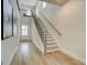 Bright entryway with hardwood floors and staircase with stylish railings at 4484 Eastbrook Pl # 54B, Snellville, GA 30039