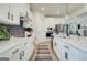 Contemporary kitchen with white cabinets, stainless appliances, and a kitchen island at 4484 Eastbrook Pl # 54B, Snellville, GA 30039