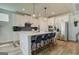 Stylish kitchen featuring a center island, stainless steel appliances, and modern lighting at 4484 Eastbrook Pl # 54B, Snellville, GA 30039