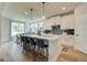 Bright kitchen with a large island, pendant lighting, and modern appliances at 4484 Eastbrook Pl # 54B, Snellville, GA 30039