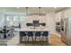 Modern kitchen with stainless steel appliances, quartz counters, and large island at 4484 Eastbrook Pl # 54B, Snellville, GA 30039