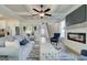 Spacious living room with fireplace and open layout to kitchen and dining area at 4484 Eastbrook Pl # 54B, Snellville, GA 30039