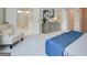 Relaxing bedroom featuring a sitting area, grey walls, grey carpet, and double doors to the ensuite bathroom at 4484 Eastbrook Pl # 54B, Snellville, GA 30039