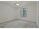 Bedroom with wall-to-wall carpet, neutral paint and a bright window at 205 Shadowood Ln, Peachtree City, GA 30269