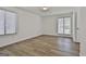 Large bedroom featuring wood floors, white walls, two windows and a closet at 205 Shadowood Ln, Peachtree City, GA 30269