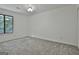 Bedroom with wall-to-wall carpet, neutral paint and a bright window at 205 Shadowood Ln, Peachtree City, GA 30269