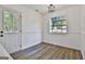 Bright dining area featuring wood floors, white wainscoting and a window view to the backyard at 205 Shadowood Ln, Peachtree City, GA 30269