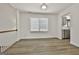 Open dining room with bright white walls and light-colored wood flooring at 205 Shadowood Ln, Peachtree City, GA 30269