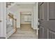 Inviting foyer with gleaming wood floors, staircase, and a view into the bright and open living spaces at 205 Shadowood Ln, Peachtree City, GA 30269