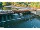 Aerial view of Lake Peachtree bridge featuring a charming bridge and flowing water at 205 Shadowood Ln, Peachtree City, GA 30269