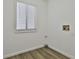 The spacious laundry room includes hookups, a window, and laminate wood flooring at 205 Shadowood Ln, Peachtree City, GA 30269