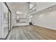Spacious living room featuring bright white walls and light-colored wood flooring at 205 Shadowood Ln, Peachtree City, GA 30269