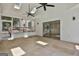 Bright sunroom with skylights, ceiling fans, and access to the outdoors through sliding glass doors at 205 Shadowood Ln, Peachtree City, GA 30269
