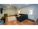 Spacious basement with hardwood floors, a ceiling fan, and an exit door at 302 Aspen Valley Ln, Dallas, GA 30157