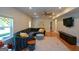 Bright basement features hardwood floors, sectional couch, and mounted television at 302 Aspen Valley Ln, Dallas, GA 30157