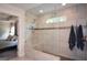 Modern shower with glass enclosure, tile surround, rain shower head, and a bench seat at 302 Aspen Valley Ln, Dallas, GA 30157