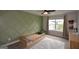 Toddler bedroom with stylish sage green accent wall, plush carpet, and lots of natural light at 302 Aspen Valley Ln, Dallas, GA 30157