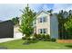 Attractive two-story home with well-maintained landscaping, a brick and siding facade, and an attached garage at 302 Aspen Valley Ln, Dallas, GA 30157