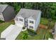 Aerial view of brick home with a well-manicured front lawn at 302 Aspen Valley Ln, Dallas, GA 30157