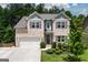 Beautiful two-story brick home with a well-manicured front lawn at 302 Aspen Valley Ln, Dallas, GA 30157