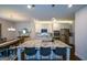 Open-concept kitchen featuring a large island and modern appliances with adjacent dining area at 302 Aspen Valley Ln, Dallas, GA 30157