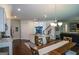Bright, open kitchen featuring a large island, modern appliances, and adjacent dining area, perfect for entertaining at 302 Aspen Valley Ln, Dallas, GA 30157