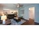 Open-concept living area connecting to a modern kitchen and dining space, creating a cohesive living experience at 302 Aspen Valley Ln, Dallas, GA 30157