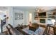 Comfortable living room with a fireplace and a view of the staircase, perfect for Gathering gatherings at 302 Aspen Valley Ln, Dallas, GA 30157