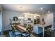 Spacious living space seamlessly connecting the dining area and kitchen, ideal for modern living at 302 Aspen Valley Ln, Dallas, GA 30157