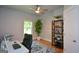 A well-lit office space with a large window, desk, and shelving at 302 Aspen Valley Ln, Dallas, GA 30157