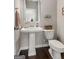 Powder room featuring a pedestal sink and modern fixtures at 2829 Wild Laurel Ct, Norcross, GA 30071