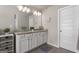 Bathroom featuring double sinks, stylish lighting, and neutral wall decor at 2829 Wild Laurel Ct, Norcross, GA 30071