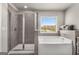 This bathroom has a combined bathtub and shower with grey tiles at 2829 Wild Laurel Ct, Norcross, GA 30071