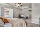 Spacious bedroom with a ceiling fan, lots of natural light, and an adjoining bathroom at 2829 Wild Laurel Ct, Norcross, GA 30071