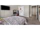 Cozy bedroom featuring a vanity, dresser, and closet, with a TV on the wall at 2829 Wild Laurel Ct, Norcross, GA 30071