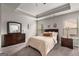 Comfortable bedroom features a dresser, two windows and a decorative ceiling fan at 2829 Wild Laurel Ct, Norcross, GA 30071