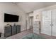Bedroom boasts a flat-screen TV and storage solutions, creating a neat and organized space at 2829 Wild Laurel Ct, Norcross, GA 30071