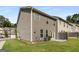 Two-story home with neutral siding, green lawn, and a cozy patio area at 2829 Wild Laurel Ct, Norcross, GA 30071