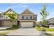 Charming two-story townhome featuring a two-car garage and traditional architectural details at 2829 Wild Laurel Ct, Norcross, GA 30071