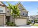 Charming townhome featuring a two-car garage and traditional architectural details at 2829 Wild Laurel Ct, Norcross, GA 30071