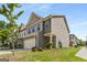Charming two-story townhome featuring a two-car garage and traditional architectural details at 2829 Wild Laurel Ct, Norcross, GA 30071
