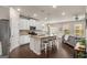 Spacious kitchen with granite countertops and stainless steel appliances overlooking the living room at 2829 Wild Laurel Ct, Norcross, GA 30071