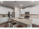 Spacious kitchen with granite countertops, white cabinets, stainless steel appliances, and seating at 2829 Wild Laurel Ct, Norcross, GA 30071