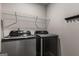 Convenient laundry room with modern appliances and shelving for storage at 2829 Wild Laurel Ct, Norcross, GA 30071