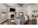 Cozy living room with hardwood floors, fireplace, ceiling fan, and neutral decor at 2829 Wild Laurel Ct, Norcross, GA 30071